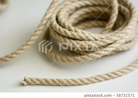 Coarse rope roll on a white surface 38731571