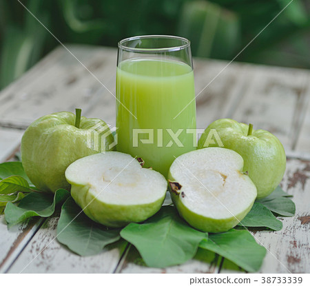 Guava juice and fresh Guava on wooden background 38733339