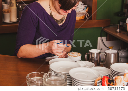 Latte art on the cup 38733373