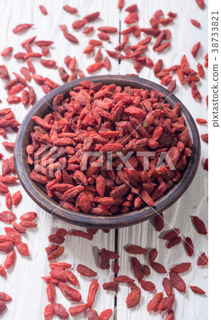 Goji berries in wooden spoon 38733821
