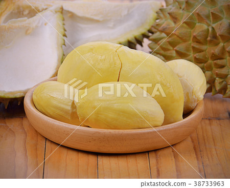 Durian isolated on wooden background. 38733963