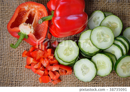 Sweet pepper and cucumber isolated on wooden  38735091