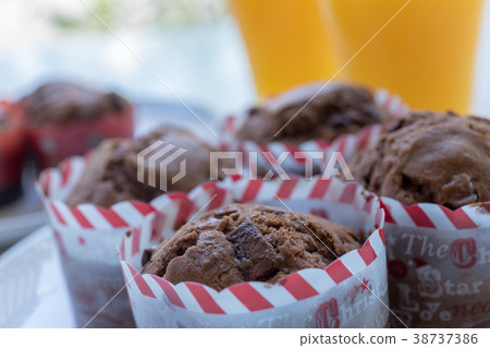 Homemade cupcake and orange juice 38737386