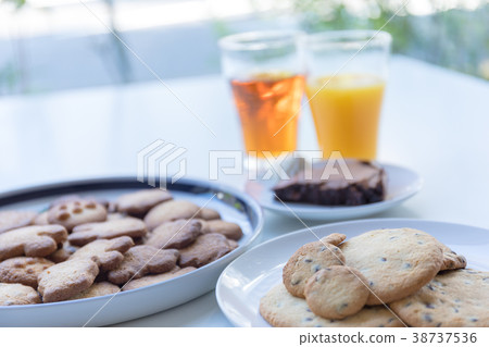 Cookies And Drinks On Windowsill In Cafe Stock Photo 38737536