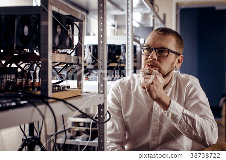 A person thinks next to computer devices A person thinks next to computer devices 38738722