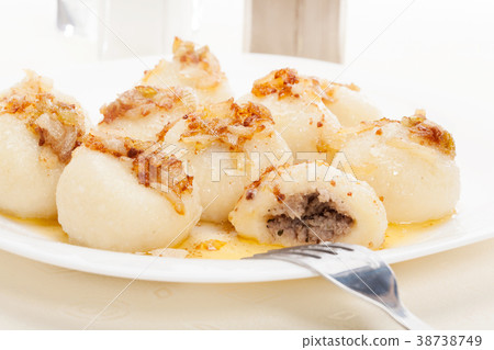 Meat stuffed dumplings with fried onion Meat stuffed dumplings with fried onion 38738749