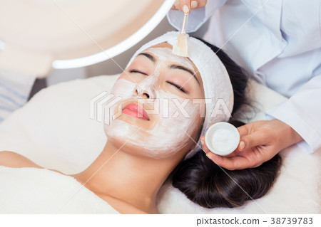 Young woman relaxing under the gentle touch of the 38739783