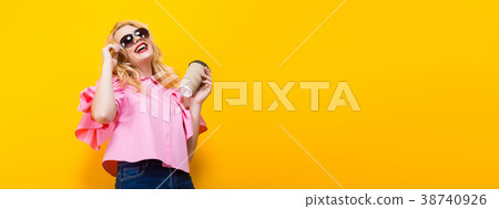 Woman in pink blouse with sunglasses and coffee Woman in pink blouse with sunglasses and coffee 38740926