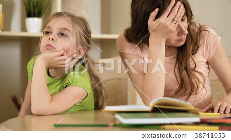 Upset mother is angry to little bored daughter Upset mother is angry to little bored daughter 38741053