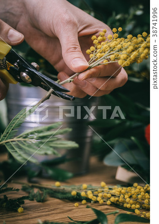Florist making beautiful bouquet 38741996