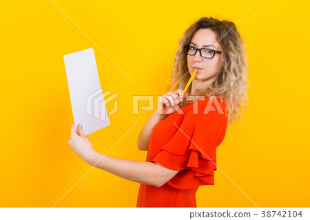 Woman in dress with blank paper and pencil 38742104