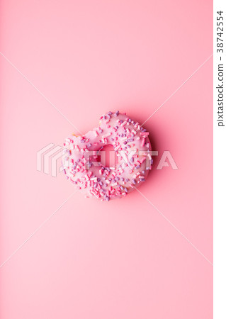 A bitten donut. 38742554
