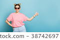 woman in sunglasses on a blue background 38742697
