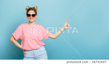 woman in sunglasses on a blue background 38742697