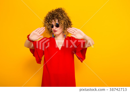 Attractive woman with short curly hair Attractive woman with short curly hair 38742713