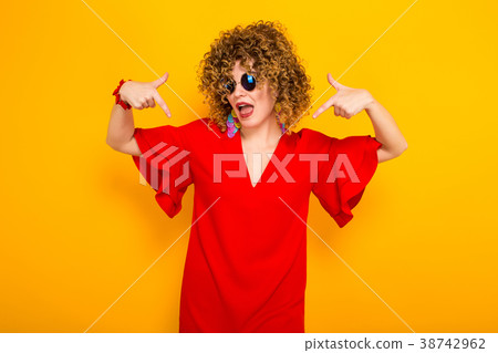 Attractive woman with short curly hair Attractive woman with short curly hair 38742962