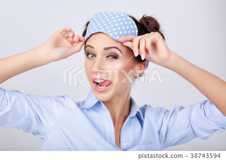 woman in pajamas and mask for sleeping woman in pajamas and mask for sleeping 38743594
