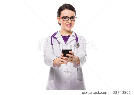 Young woman doctor with stethoscope offering wine Young woman doctor with stethoscope offering wine 38743805
