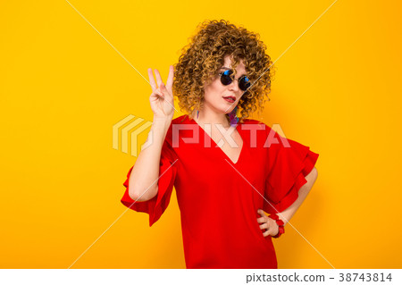 Attractive woman with short curly hair Attractive woman with short curly hair 38743814