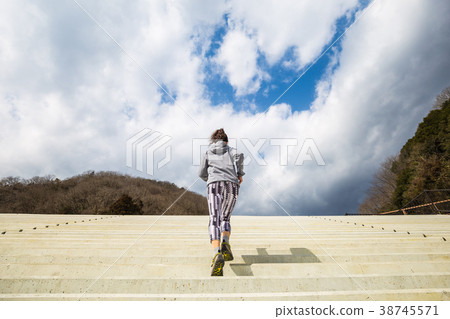 Sporty woman and sky 38745571