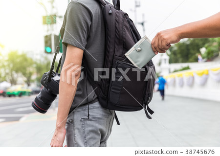 pickpocket stealing wallet from tourist 38745676
