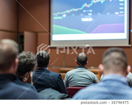 Audience in conference hall listening to 38746475