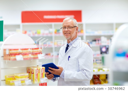 senior with tablet pc at pharmacy 38746962