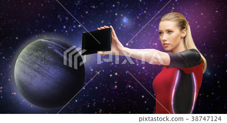 futuristic woman with tablet pc over space 38747124