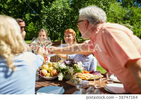 happy family having dinner or summer garden party happy family having dinner or summer garden party 38747164