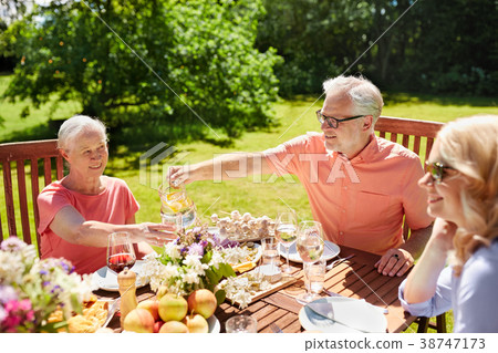 happy family having dinner or summer garden party 38747173