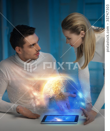 couple with tablet pc at space laboratory couple with tablet pc at space laboratory 38747303
