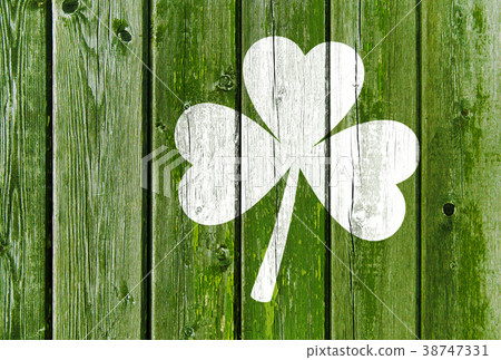 shamrock silhouette on old green wooden boards shamrock silhouette on old green wooden boards 38747331