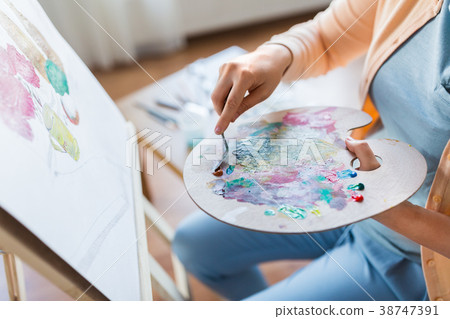 artist with palette knife painting at art studio artist with palette knife painting at art studio 38747391