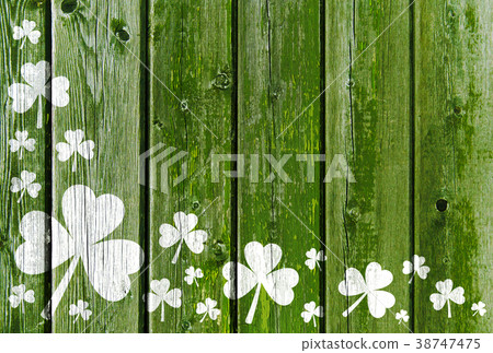 shamrock pattern on old green wooden boards 38747475