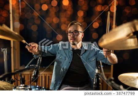 musician playing drum kit at concert over lights musician playing drum kit at concert over lights 38747799