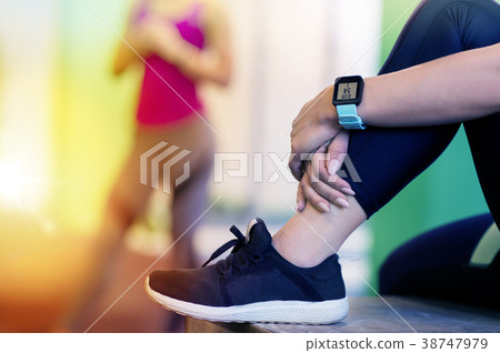 close up of woman with heart rate tracker in gym 38747979