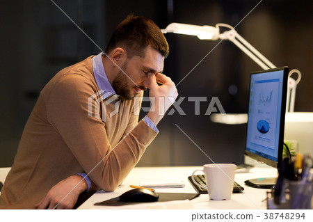 tired businessman working at night office tired businessman working at night office 38748294