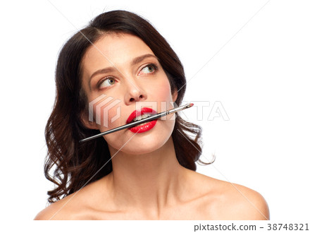 beautiful woman holding make up brush for lipstick beautiful woman holding make up brush for lipstick 38748321