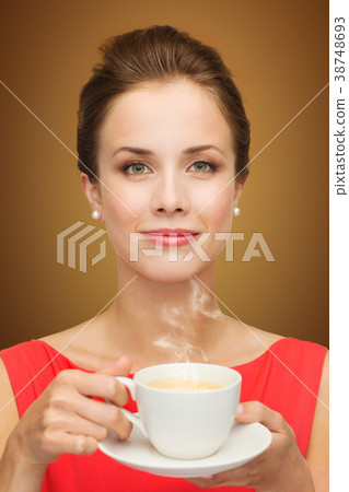 beautiful woman in red dress with cup of coffee beautiful woman in red dress with cup of coffee 38748693