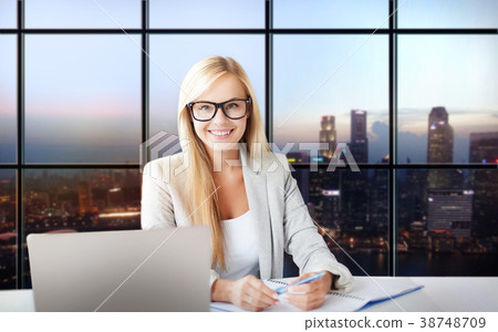 happy businesswoman with documents at office 38748709