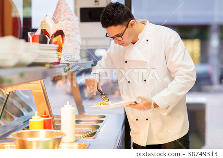 chef with salad on plate at fast food restaurant chef with salad on plate at fast food restaurant 38749313