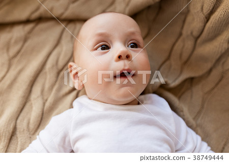 sweet little baby boy lying on knitted blanket sweet little baby boy lying on knitted blanket 38749444