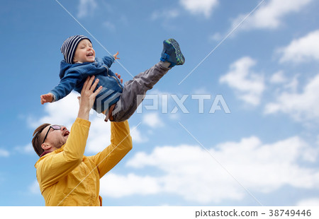 father with son playing and having fun outdoors father with son playing and having fun outdoors 38749446