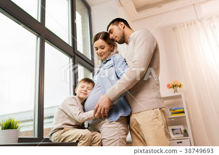 happy family with pregnant mother at home happy family with pregnant mother at home 38749693