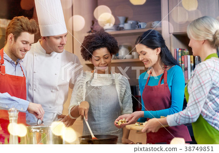 happy friends and chef cook cooking in kitchen happy friends and chef cook cooking in kitchen 38749851