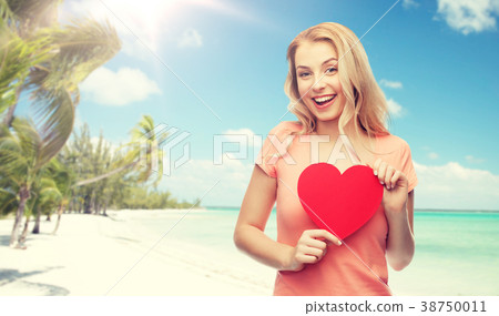 happy woman or teen girl with red heart shape happy woman or teen girl with red heart shape 38750011