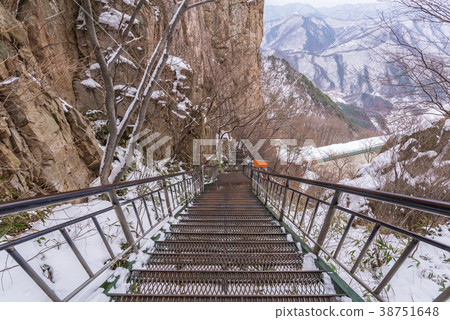 Snowy stairs covered in winter at the park 38751648