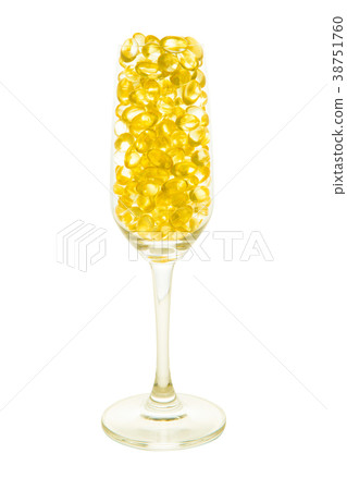 Fish oil capsule in champagne glass with path  38751760