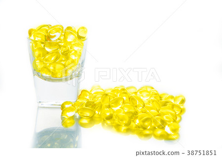 Fish oil, soft capsule, omega, supplement in glass Fish oil, soft capsule, omega, supplement in glass 38751851