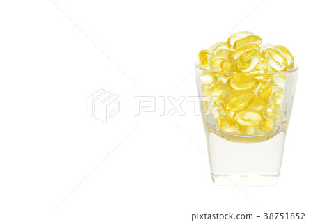Fish oil soft capsule in glass with clipping path 38751852